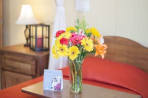 Flowers by a patient's bed at Lincoln Meadows