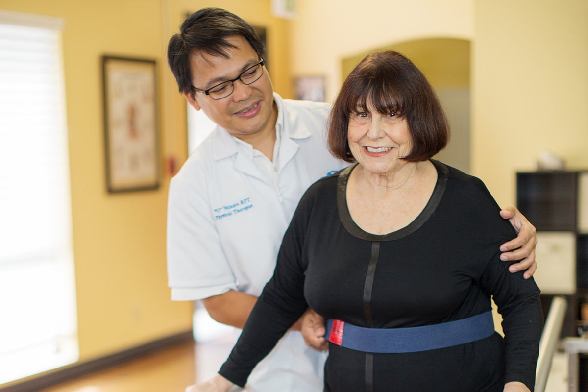 A woman doing physical therapy with a therapist at Lincoln Meadows